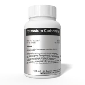 Potassium Carbonate bottle with warning label.