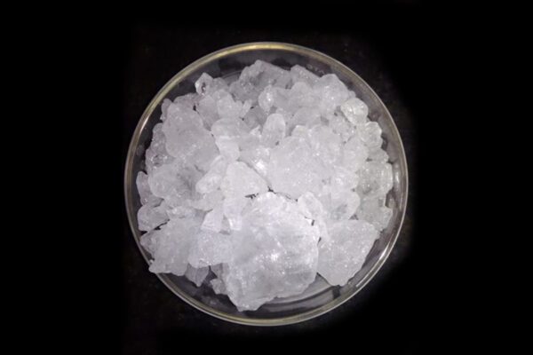 White crystals in a glass dish.